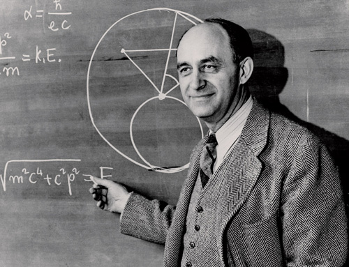 Picture of Enrico Fermi in front of a black board
